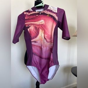 Tri Sirena short sleeved swim suit. Never used Size L no tags.